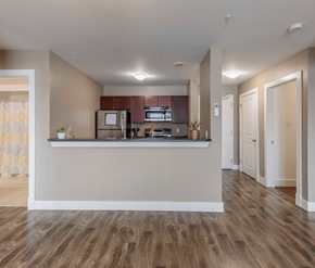 Fredericton apartment for rent - A kitchen with a refrigerator, microwave, and oven.