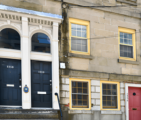 Halifax apartment for rent - A building with a red door and a blue door with the number 1350 on it.