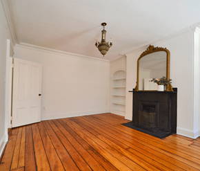 Halifax apartment for rent - A room with a fireplace and a mirror.
