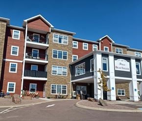 Dieppe apartment for rent - The image shows a multi-story building with the name "Place Beaulieu" on the front.