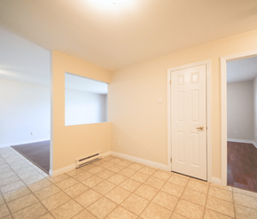 Dieppe apartment for rent - A room with a white door and a window.