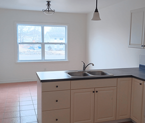 Saint John apartment for rent - A kitchen with a sink and cabinets.