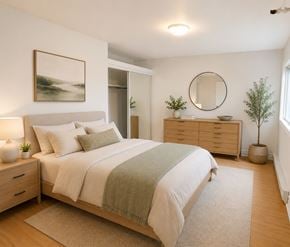 St. Johns apartment for rent - A bedroom with a bed, nightstand, and a painting on the wall.