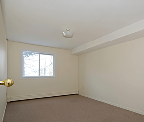 Halifax apartment for rent - A room with a window and a carpeted floor.