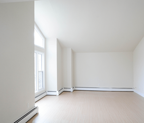 Halifax apartment for rent - A large empty room with a window on the left side.