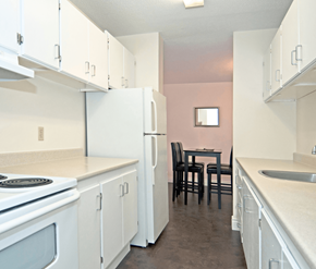 Halifax apartment for rent - A kitchen with white cabinets and a pink wall.