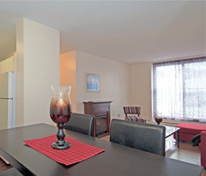 Halifax apartment for rent - A dining table with a red placemat and a glass vase with a candle inside.