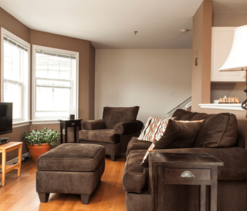 Halifax apartment for rent - A living room with brown furniture and a flat screen TV.