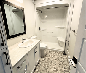Fredericton apartment for rent - A bathroom with a sink, toilet, and shower.