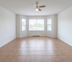 Saint John apartment for rent - Empty room with a ceiling fan and tiled floor.