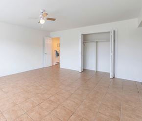 Saint John apartment for rent - A room with a ceiling fan and tile flooring.