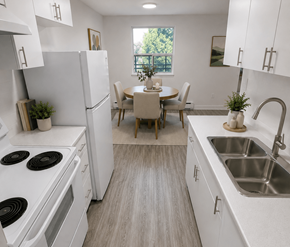 London apartment for rent - A kitchen with white appliances and a dining table with chairs.