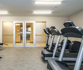 St. Johns apartment for rent - A gym with treadmills and a sign that says "moonwalk".