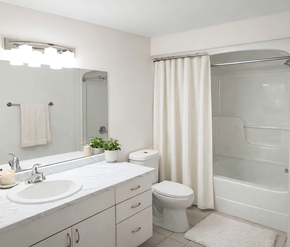 Moncton apartment for rent - A white bathroom with a sink, toilet, and shower.