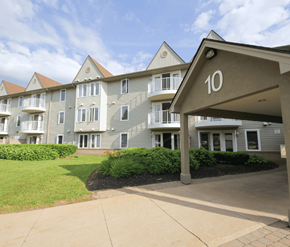 Moncton apartment for rent - Apartment building number 10 with a green lawn in front.