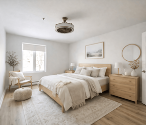 Moncton apartment for rent - A bedroom with a large bed, a chair, and a plant.