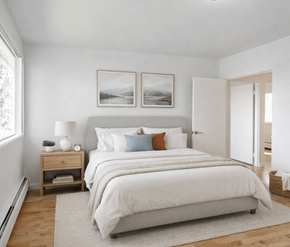 Victoria apartment for rent - A bedroom with a large bed and two pictures on the wall.