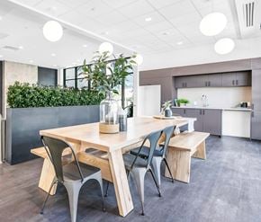 Kitchener apartment for rent - A modern dining area with a wooden table and chairs.