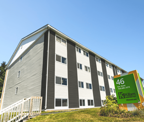 St. Johns apartment for rent - A large building with the number 46 on a sign in front of it.