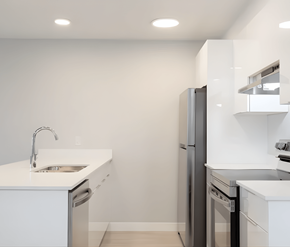 Courtenay apartment for rent - A modern kitchen with a white countertop and stainless steel appliances.