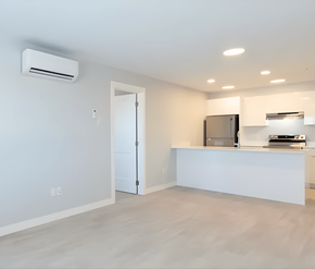 Courtenay apartment for rent - A modern kitchen with a white countertop and a stainless steel refrigerator.