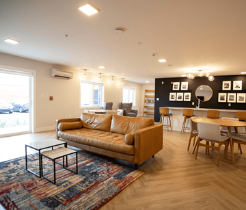 Stratford apartment for rent - A living room with a tan couch and a coffee table.