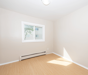 Saint John apartment for rent - A room with a window and a radiator on the wall.