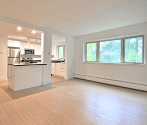 Fredericton apartment for rent - A kitchen with a refrigerator, microwave, and oven.