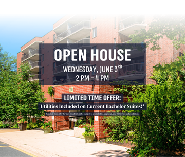 Fredericton apartment for rent - A red brick building with a sign that says "OPEN HOUSE" on it.