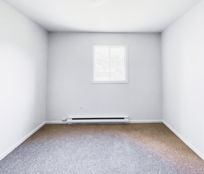 St. Johns apartment for rent - A room with a window and a radiator on the floor.