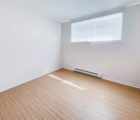 St. Johns apartment for rent - A room with a window and a radiator on the floor.