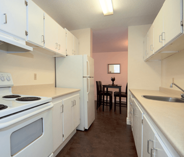 Halifax apartment for rent - A kitchen with white appliances and cabinets.