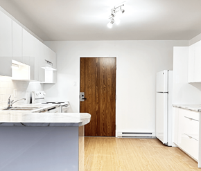 Moncton apartment for rent - A kitchen with a sink, refrigerator, and cabinets.