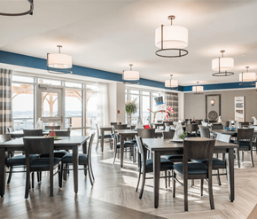 Dieppe apartment for rent - A modern dining room with a large table and chairs.