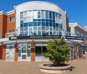 Dieppe apartment for rent - A building with a sign that reads "3333 Mossotherapy Massage Therapy".