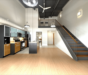Dieppe apartment for rent - A modern kitchen with a staircase leading to the upper floor.