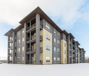 Moncton apartment for rent - A large apartment building with balconies and multiple stories.