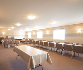 Fredericton apartment for rent - A conference room with a long table and chairs.