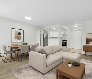 Waterloo apartment for rent - A modern living room with a beige sofa, a wooden coffee table, and a dining table with chairs.