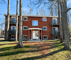 Waterloo apartment for rent - A red brick building with a white door and windows.