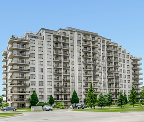London apartment for rent - A large apartment building with balconies and trees in front.