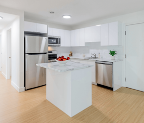 Saint John apartment for rent - A modern kitchen with a white island in the middle.