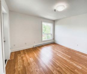 St. Johns apartment for rent - A room with wooden flooring and a window.