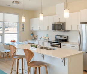 Cambridge apartment for rent - A kitchen with white cabinets and a white countertop.