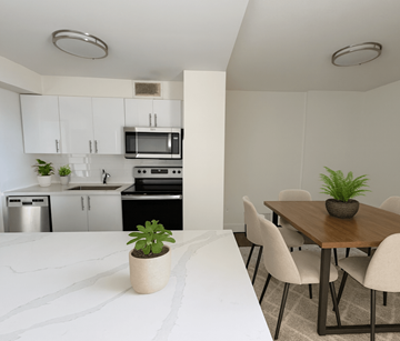 Mississauga apartment for rent - A kitchen with a dining table and chairs.