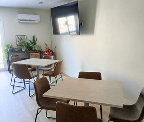Fredericton apartment for rent - A conference room with a long table and chairs.