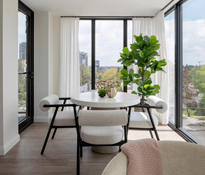 Waterloo apartment for rent - A dining room with a table and chairs and a potted plant.