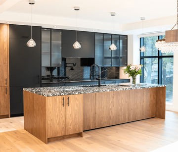 Halifax apartment for rent - A modern kitchen with wooden cabinets and a black countertop.