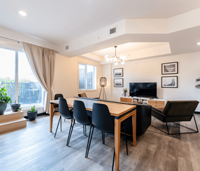 Edmonton apartment for rent - A modern dining room with a wooden table and chairs.