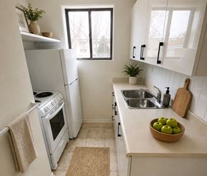 London apartment for rent - A kitchen with a white oven and white cabinets.